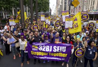 32BJ SEIU members rallied in Manhattan on Thursday afternoon for higher wages and improved benefits for NYC's union janitors.