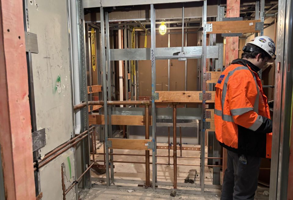 People building out the interior of 65 E. Wacker.