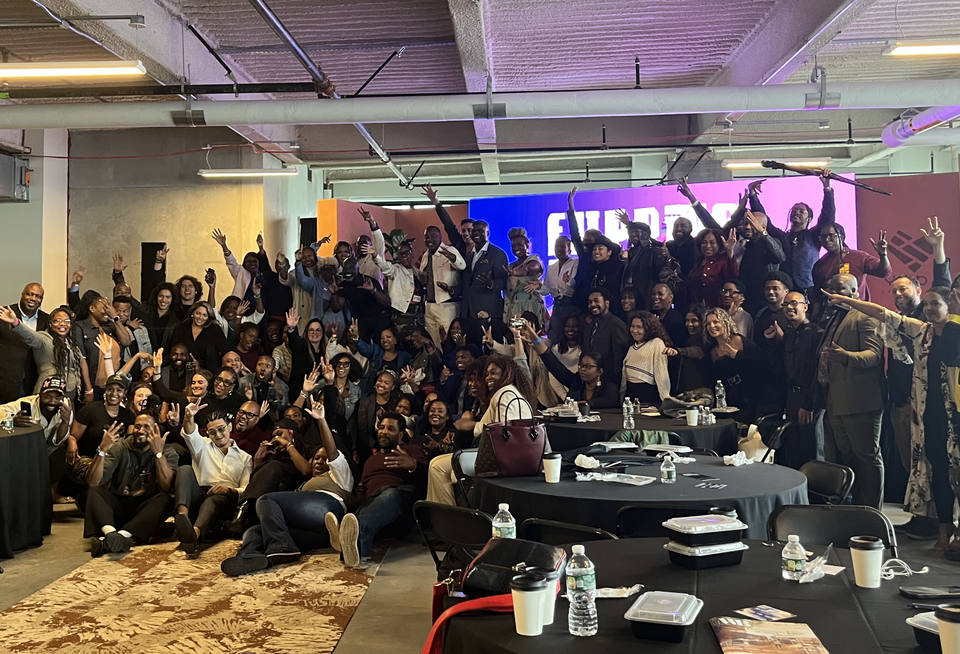 Attendees onstage at the end of Friday's panels at Yoba Development's Flipping The Hood event.