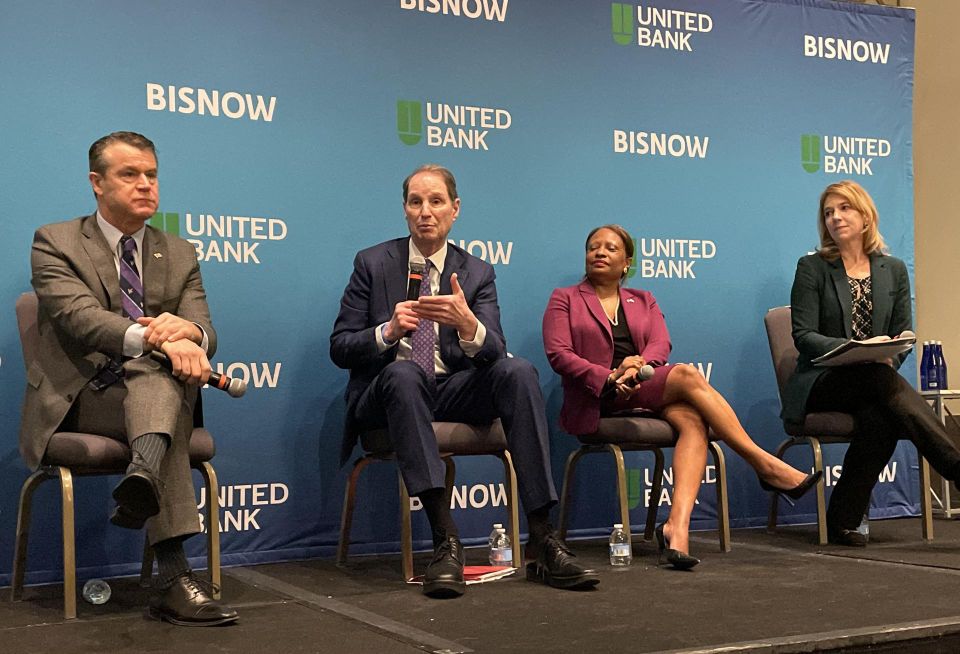 Indiana Sen. Todd Young, Oregon Sen. Ron Wyden, HUD Deputy Secretary Adrianne Todman and NMHC President Sharon Wilson Géno speak at Bisnow's 2023 multifamily conference in Washington.
