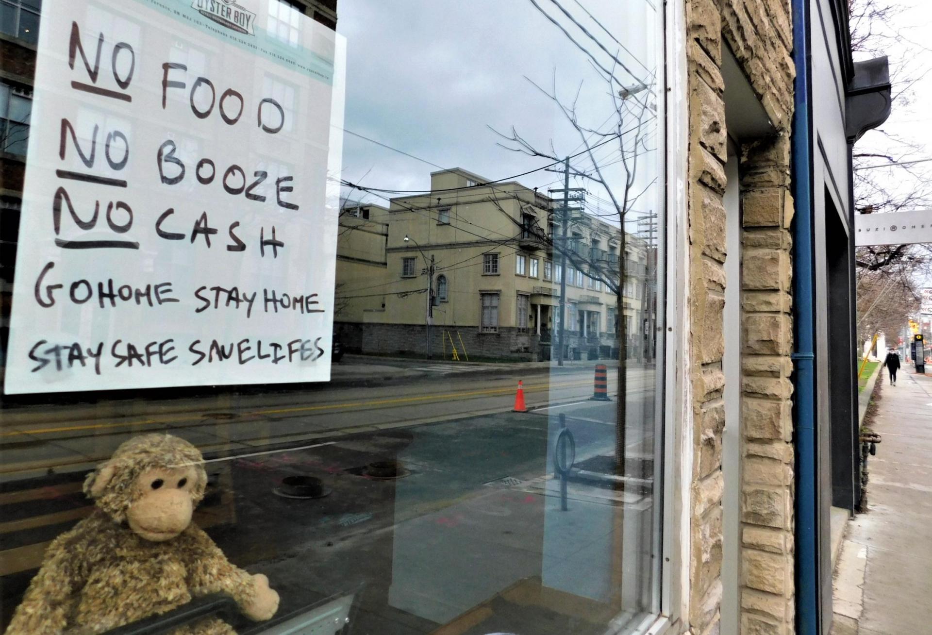 A sign on a business on Toronto's Queen Street.