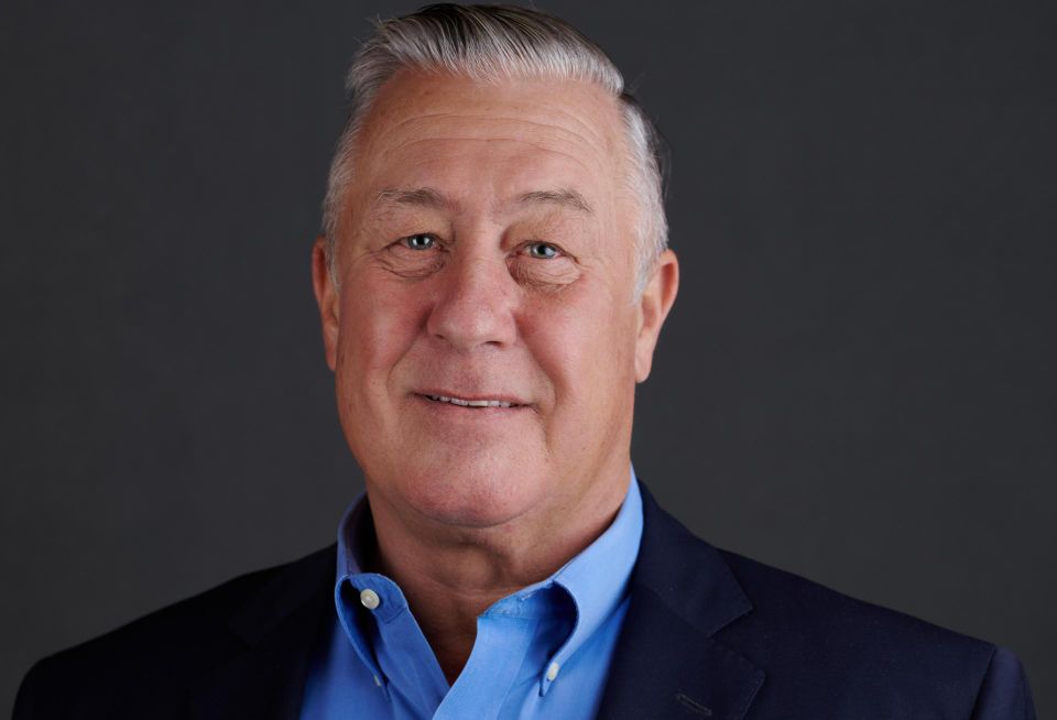 A headshot of Rocky Mountain Business Advisors CEO and Managing Broker Gregg Kunz