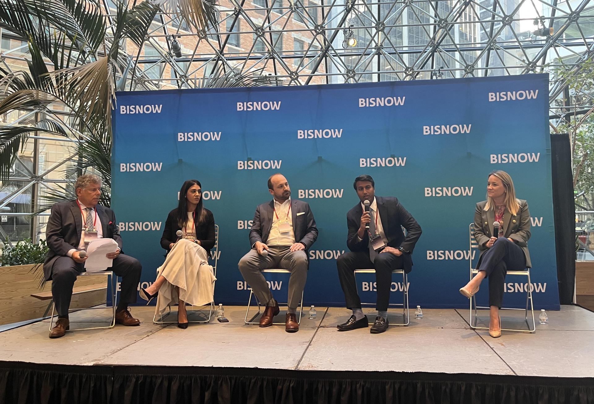 Jordan Metzger of Cole Schotz onstage at Bisnow's 2023 National Commercial Real Estate Finance Conference with Cerberus Capital Management's Neha Santiago, Slate Asset Management's Brendan Shanahan, 3650 REIT's Nishant Nadella and Newpoint Real Estate Capital's Geri Borger Urgo.