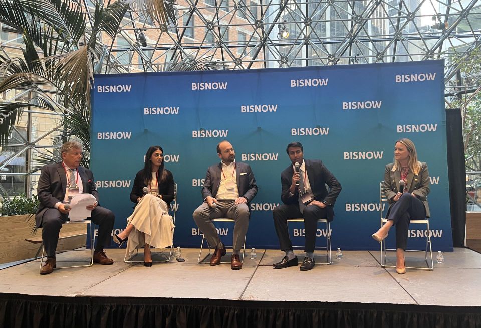 Jordan Metzger of Cole Schotz onstage at Bisnow's 2023 National Commercial Real Estate Finance Conference with Cerberus Capital Management's Neha Santiago, Slate Asset Management's Brendan Shanahan, 3650 REIT's Nishant Nadella and Newpoint Real Estate Capital's Geri Borger Urgo.