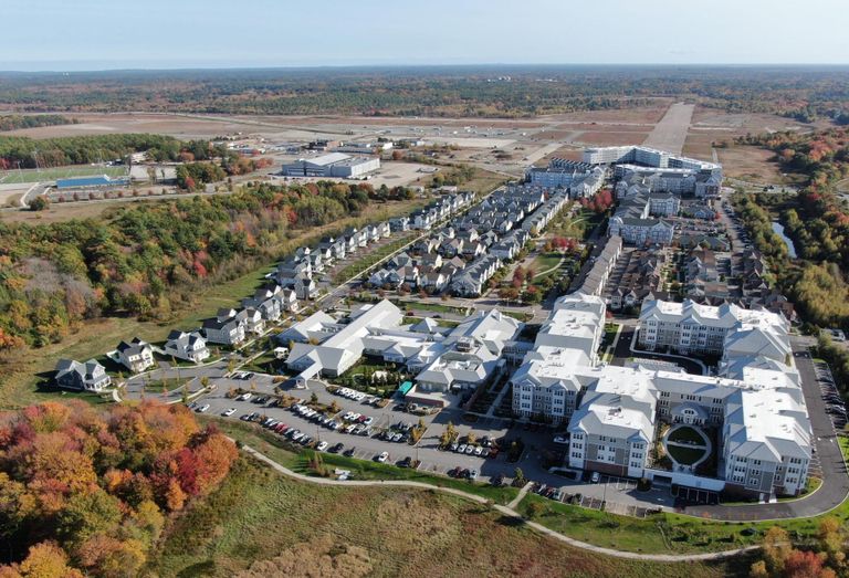 The 1,400-acre South Weymouth Naval Air Station site, with existing residential development in the foreground and future construction sites in the background.