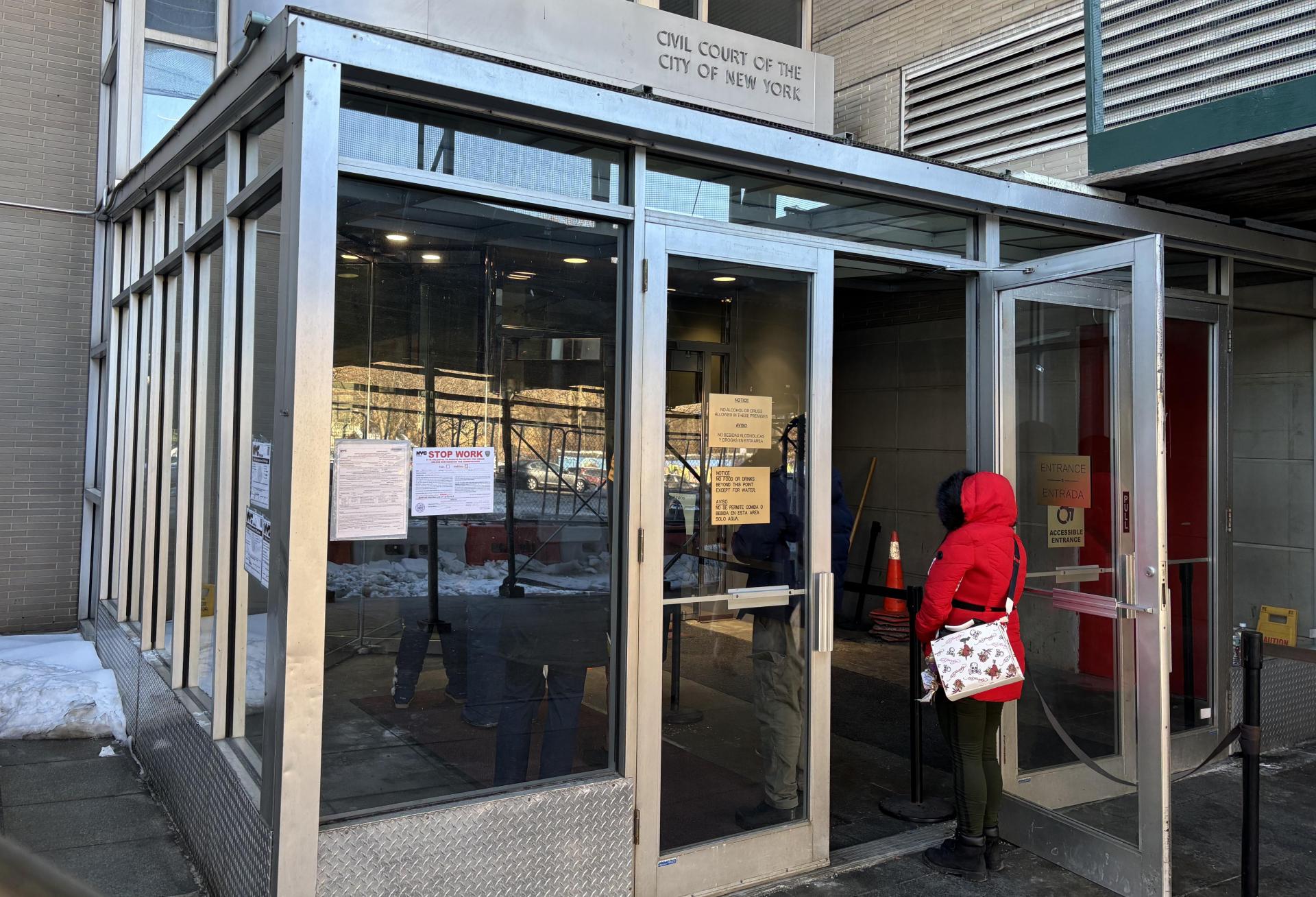 A line begins to form outside of the Bronx Housing Courthouse as tenants, landlords and lawyers go through security.