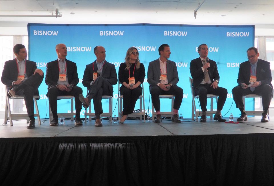 Morgan Properties' Jason Morgan, Pantzer Properties' Jason Pantzer, Harbor Group International's Matt Jones, NewPoint Real Estate Capital's Geri Borger Urgo, TruAmerica Multifamily's Matt Ferrari, Archway Capital's Tom Noble and LGA Capital's Jason Gerstein speak during a panel at Bisnow's Multifamily Annual Conference on Nov. 29, 2022.