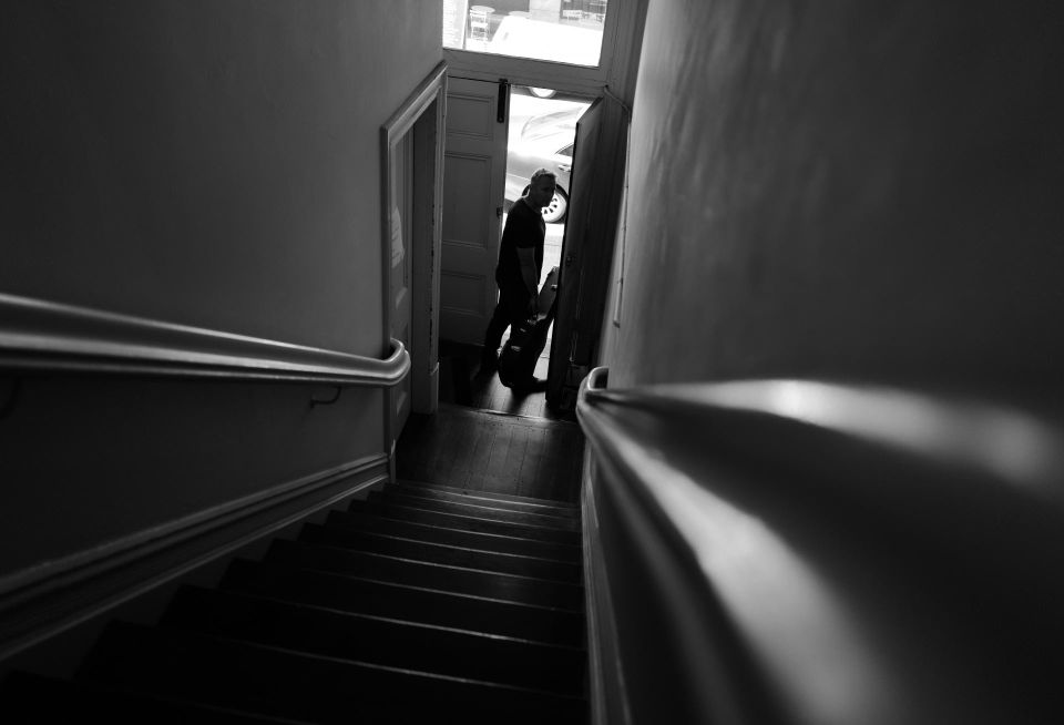 Person exiting house sad staircase brooding stairs