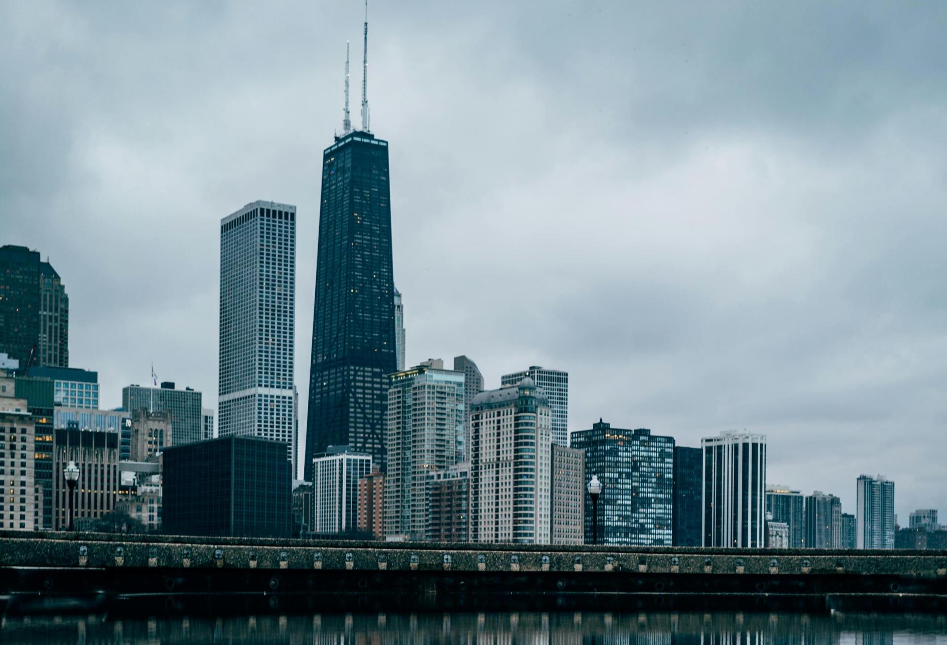 The Chicago skyline against storm clouds.