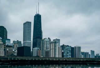The Chicago skyline against storm clouds.