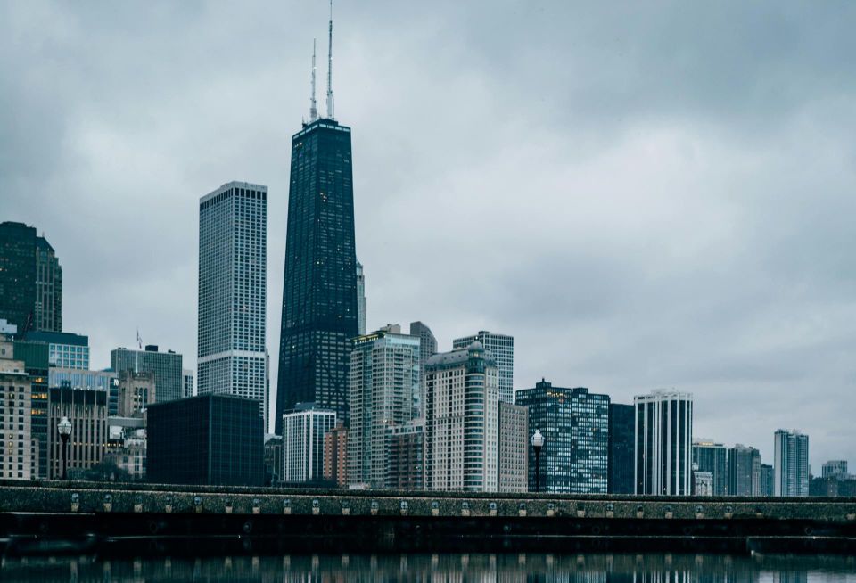 The Chicago skyline against storm clouds.