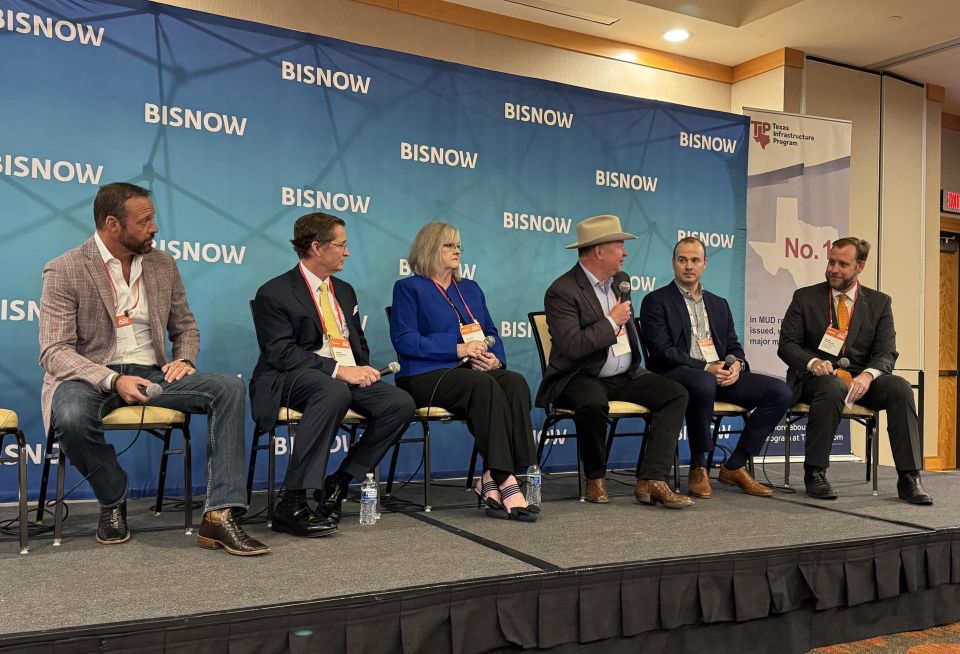 Speakers on panel at Bisnow's 2026 Houston Master Planned Communities event.
