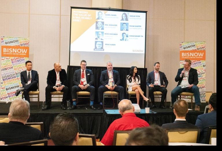 Blueground's Christopher Tin, NMS Properties' Neil Shekhter, NorthMarq's Shane Shafer, TruAmerica's Noah Hochman, Onyx Relocation's Shelby Istrin, Decron Properties' Daniel Nagel and Parakeet's Brad Huber speak on a panel at Bisnow's multifamily event. 
