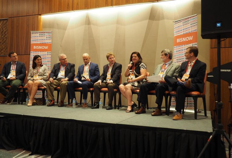 Reno & Cavanaugh's Matt Greeson, Arlington Partnership for Affordable Housing's Carmen Romero United Bank's Joe Lemense, Fairstead's Brett Meringoff, Davis Construction's Ben Apfelbaum, WinnCompanies' Aimee McHale, Michael Graves Architecture & Design's Donald Kann and MRP Realty's Matt Robinson speak during a panel at Bisnow's Washington D.C. Affordable Housing Summit on July 28, 2022.