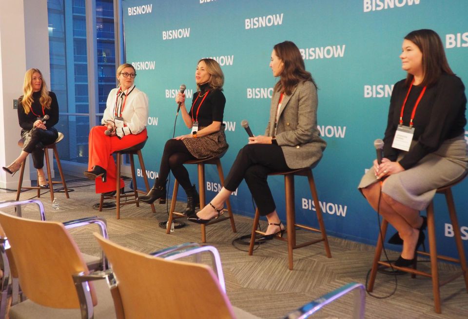 NFP's Kate McLaughlin, Urban Atlantic's Caroline Kenney, JLL's Elizabeth Cooper, Skanska's Jennifer Tatum and Monday Properties' Jennifer Burns speak during a panel at Bisnow's D.C. Region Women Leading Real Estate awards ceremony on Dec. 6, 2022.