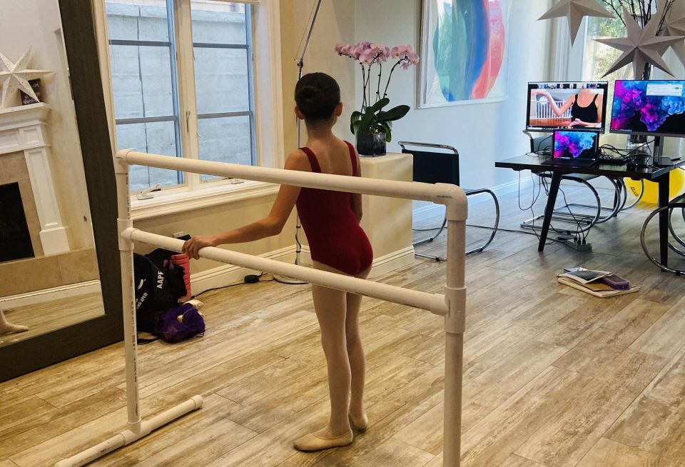 MVE + Partners Matt McLarand's daughter watches a video to practice ballet