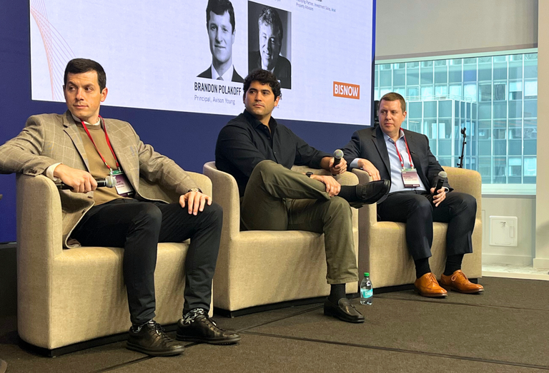 Tishman Speyer's Albert Schmool, Madison Realty Capital's Samir Tejpaul and Ariel Property Advisors Michael Tortorici onstage at Bisnow's 2025 New York City State of the Market event.