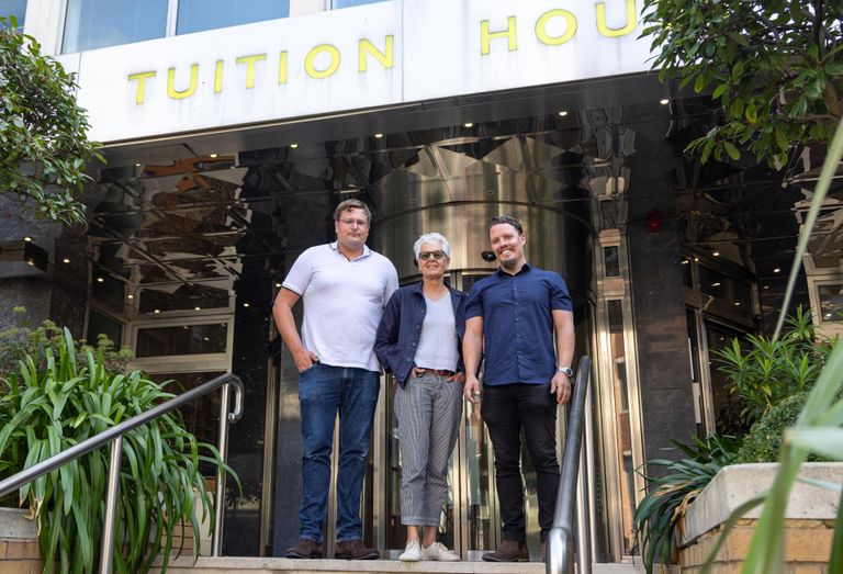Luke Taylor, Jean Taylor and Daniel Akerman of family-run Wimbledon Offices outside of London.