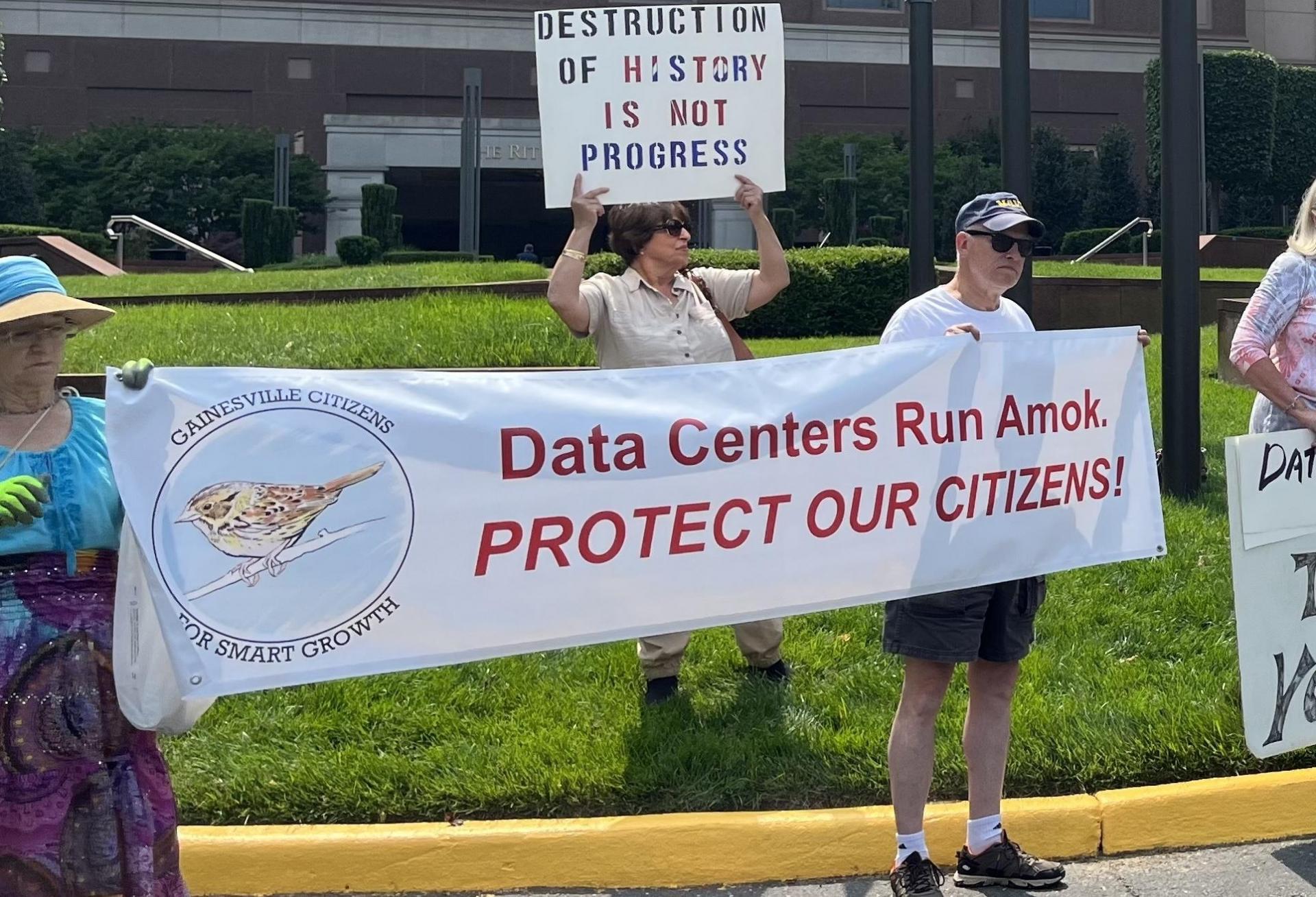Prince William county data center opponents protest outside an industry event in 2023. 