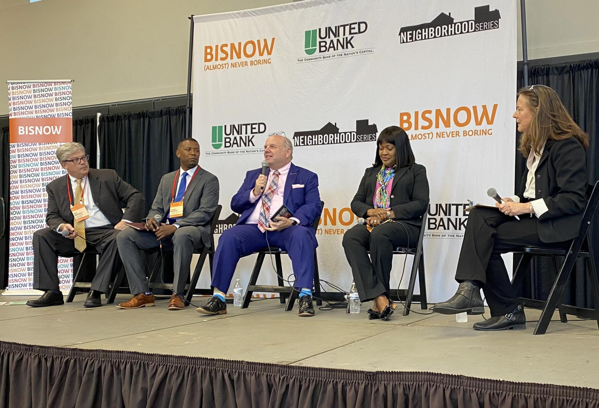 Claude Moore Charitable Foundation's Guy Gravett, Howard Hughes Medical Institute's Monti Mercer, Loudoun County Department of Economic Development's Buddy Rizer, Guardians of Honor's Susan Mitchell, and Community Foundation for Loudoun and Northern Fauquier Counties' Amy Owen speak during a panel at Bisnow's Future of Loudoun County event on Oct. 26, 2022.