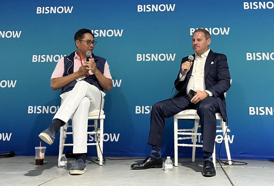 Innovo CEO Andrew Chung on stage at 2505 Bruckner with JLL's Rob Kossar.