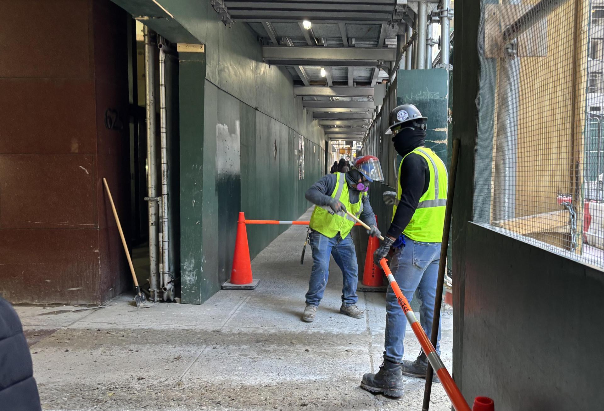 Construction workers outside 625 Madison Ave. Construction workers outside 625 Madison Ave.