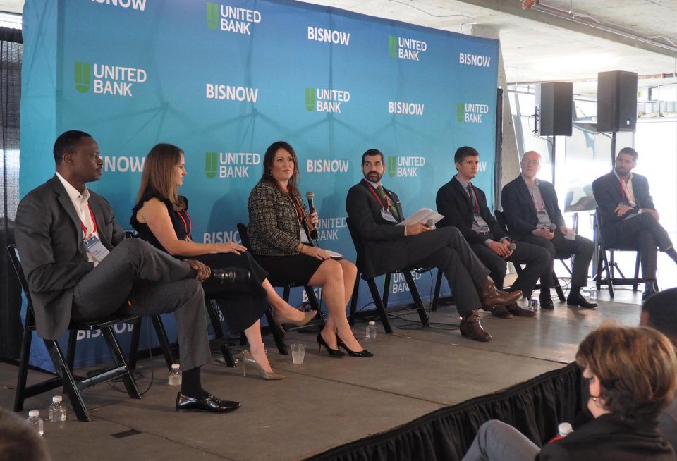 Frontier Development's Evens Charles, National Real Estate Development's Katherine Hartley, Akridge's Kristin Connall, DMPED's Sarosh Olpadwala, Donohoe Cos.' Evan Weisman, Trammell Crow's Campbell Smith and Cushman & Wakefield's Marshall Scallan speak during a panel at Bisnow's D.C. Major Projects Event on Feb. 16, 2023.