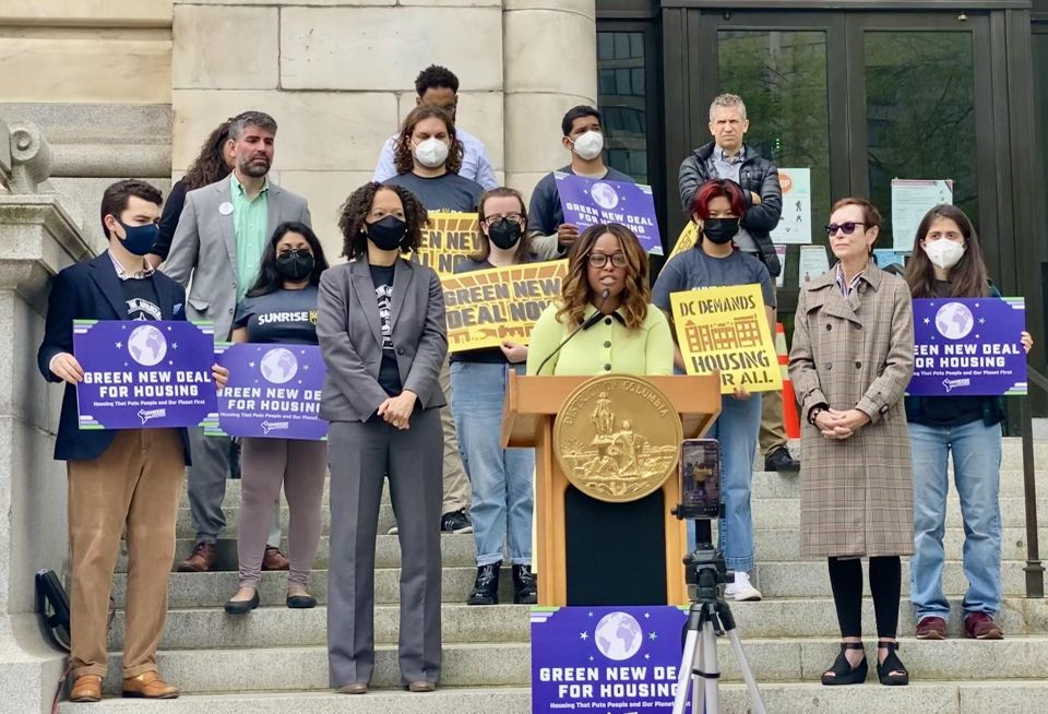 Councilmember Janeese Lewis George speaks on the steps of D.C.'s Wilson Office Building alongside supporters to announce the Green New Deal for Housing on April 26, 2022.