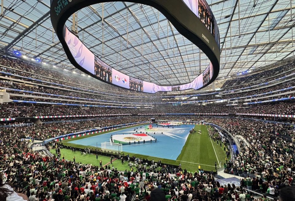 Soccer stadium filled with fans prior to a final match.