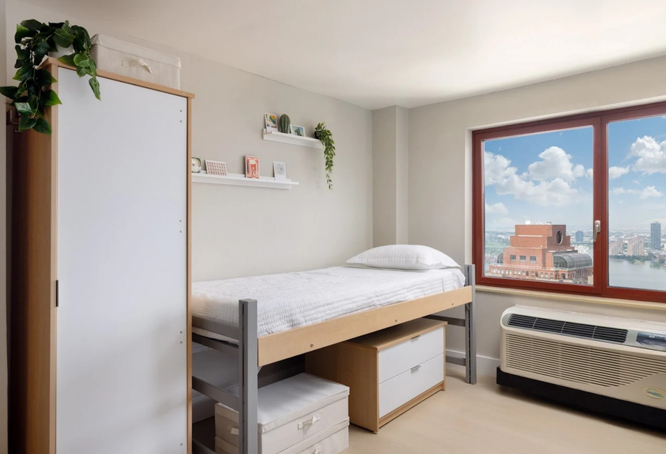 A photo of one of the new dorm rooms inside 99 Washington St., a former Holiday Inn hotel in FiDi.