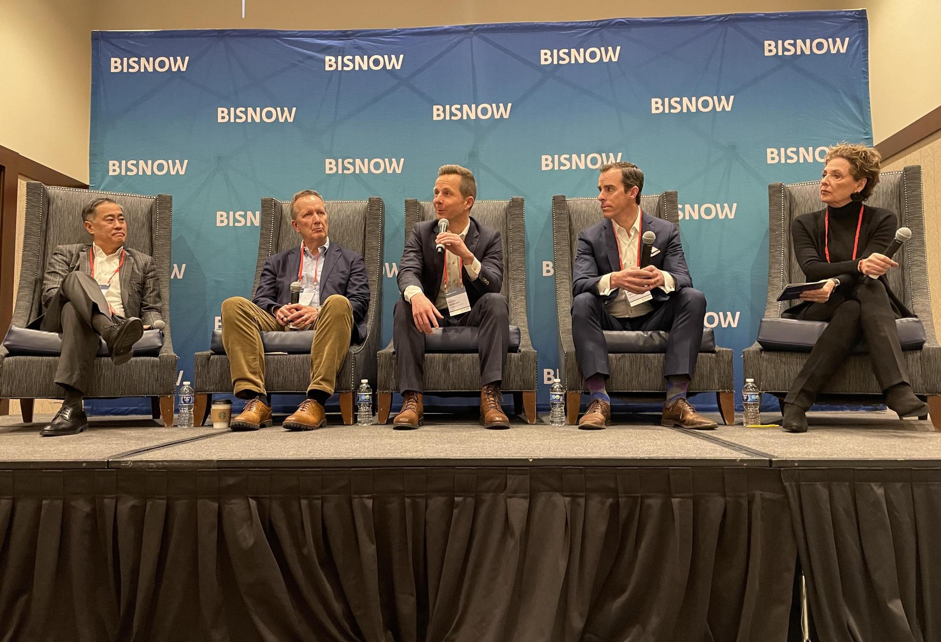 An image of the panelists on the Investment Trends panel at Bisnow's 2025 Forecast event held Jan. 23 at the Embassy Suites Denver Downtown. Riki Hashimoto, Knightbridge Capital; William Grubbs Jr., McWhinney; Peter Merrion, JLL Capital Markets; Matt Teeters, Alpine Bank; and Marcy Moneypenny, Avison Young.