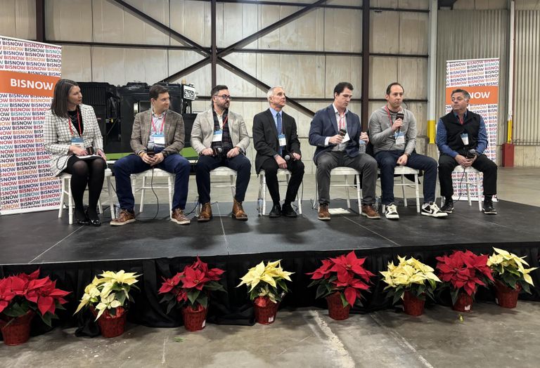 Sitting on a stage, from left to right: Landmarks Illinois' Bonnie McDonald, WindWave's Jonathan Cordell, Epstein's Patrick Carata, BTL Architects' Delph Gustitus, Concord Capital's Drew Millard, Mavrek's Anthony Hrusovsky and McHugh Construction's Ray Cisco.