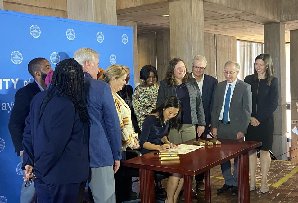 Mayor Wu signing an executive order to streamline approvals for affordable housing.