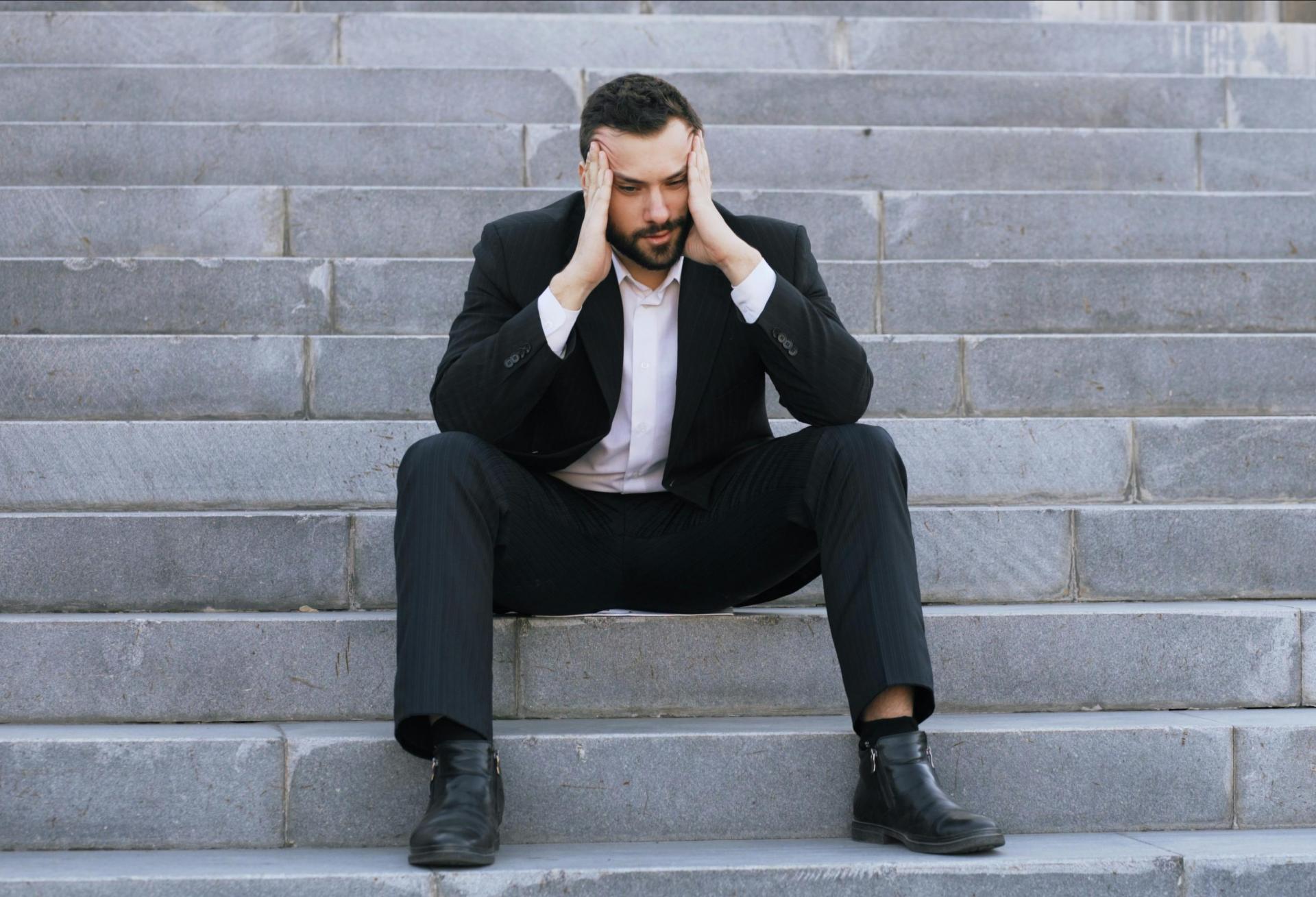 upset suit man in suit stressed