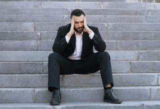 upset suit man in suit stressed