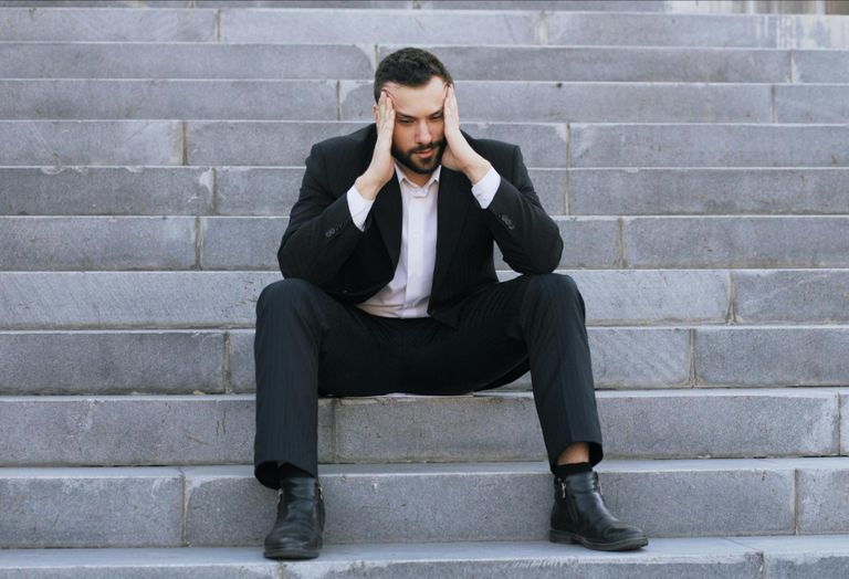 upset suit man in suit stressed