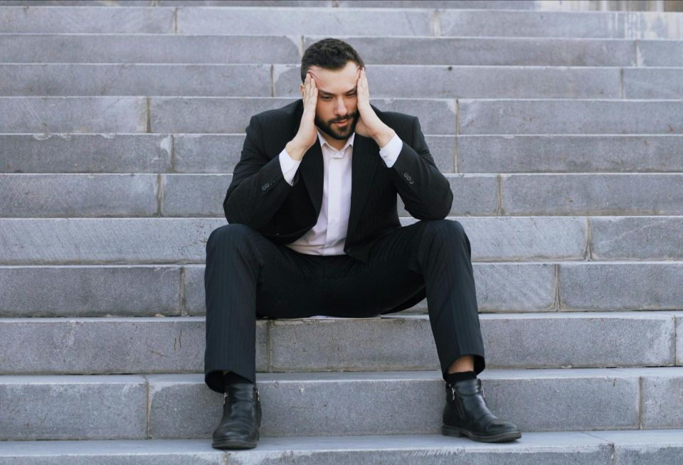 upset suit man in suit stressed