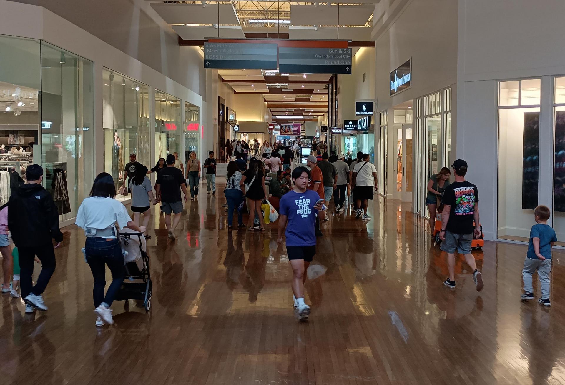 Customers walk through Simon Property Group's Grapevine Mills property in Grapevine, Texas.