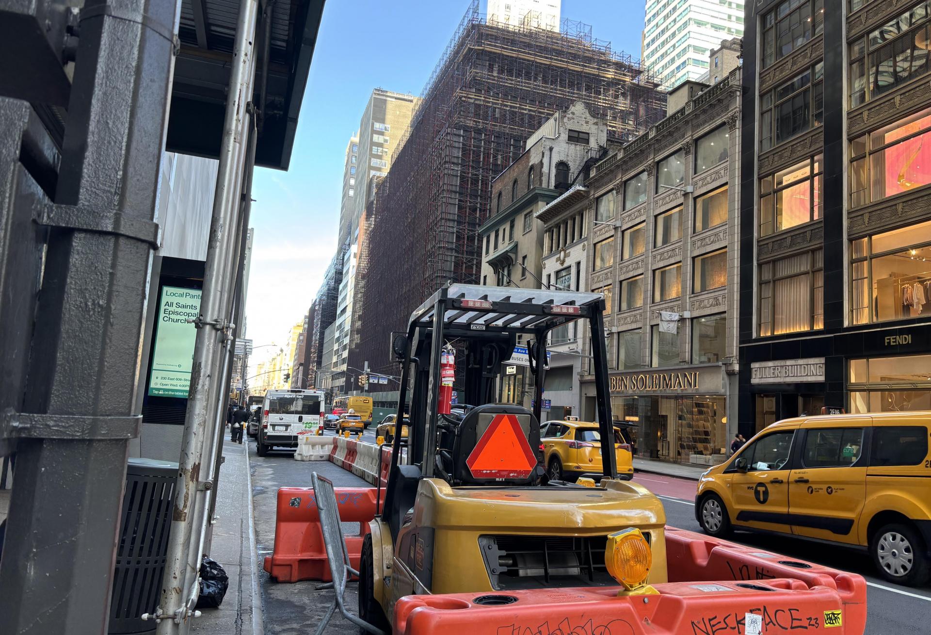 A construction vehicle in front of the LVMH tower, a block away from Related's 625 Madison Ave.