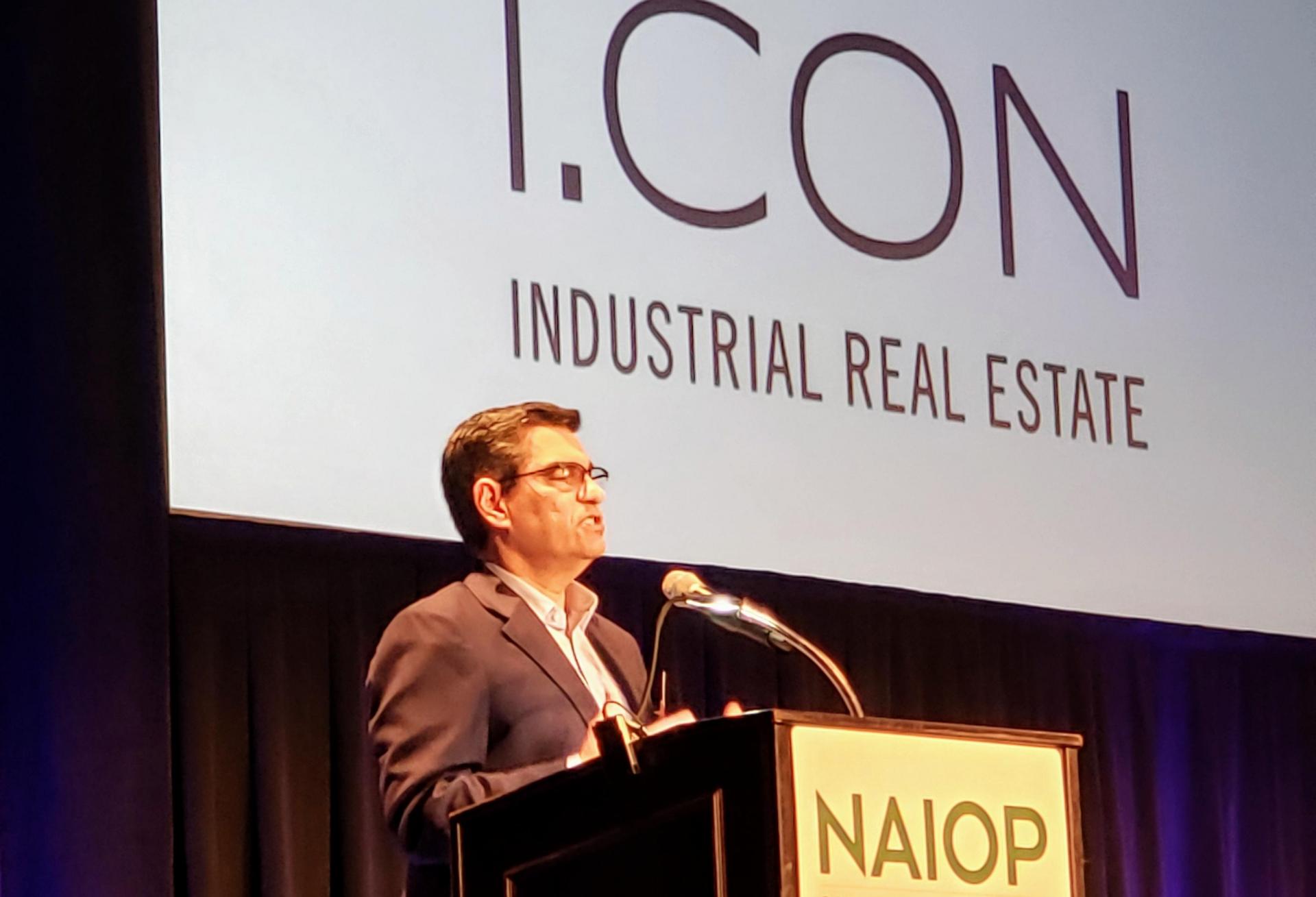 NAIOP Vice President for Government Affairs Aquiles Suarez speaks at a luncheon during NAIOP's I.CON Industrial Real Estate conference in Long Beach. NAIOP Vice President for Government Affairs Aquiles Suarez speaks at a luncheon during NAIOP's I.CON Industrial Real Estate conference in Long Beach.