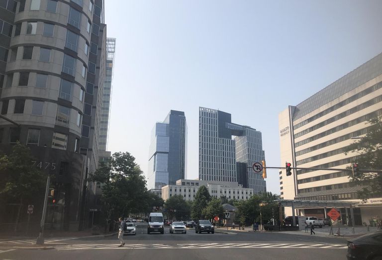 A view looking down Wisconsin Avenue in Bethesda with Carr’s The Wilson and The Elm development in the background.