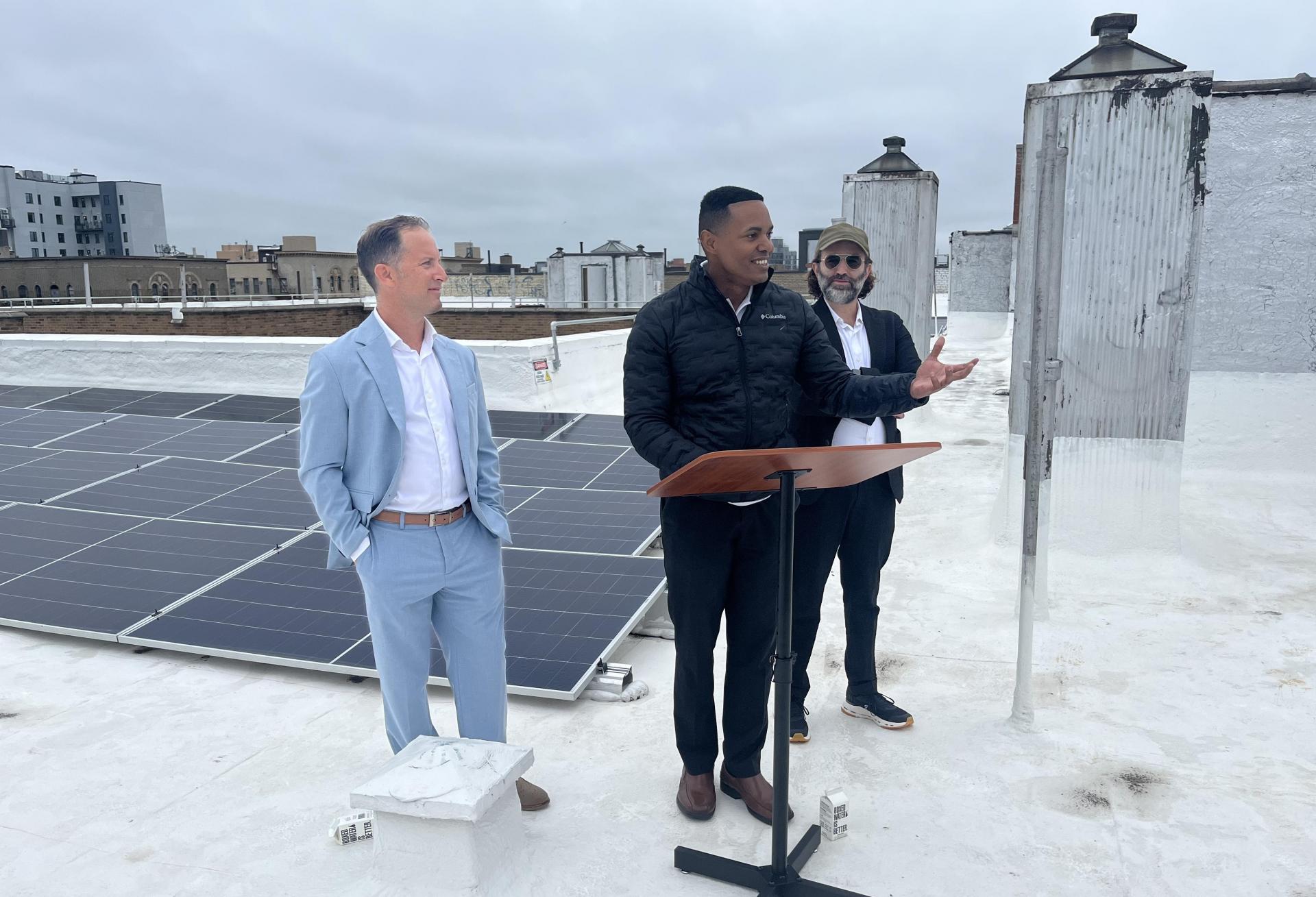 Fieldston Power's Alex Zucker and Alex Weisberg, standing either side of Congressman Ritchie Torres in the Bronx on Tuesday morning.