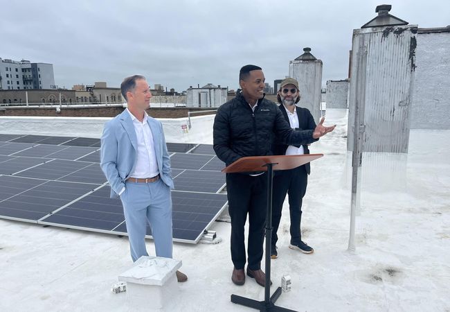 Fieldston Power's Alex Zucker and Alex Weisberg, standing either side of Congressman Ritchie Torres in the Bronx on Tuesday morning.