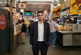 Langdon Street Capital Principal Adam Daneshgar stands in the middle of the Grand Central Market in downtown Los Angeles. 