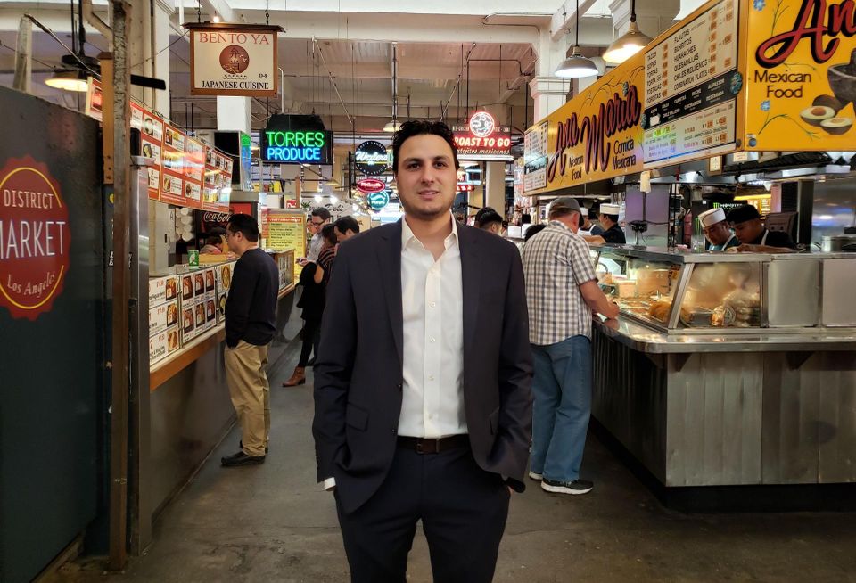 Langdon Street Capital Principal Adam Daneshgar stands in the middle of the Grand Central Market in downtown Los Angeles.