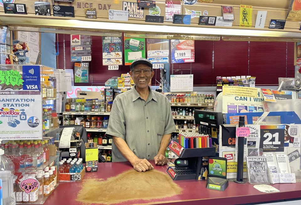 A photograph of Yohannes Hailleab, owner of Sooper B Liquors on South Broadway
