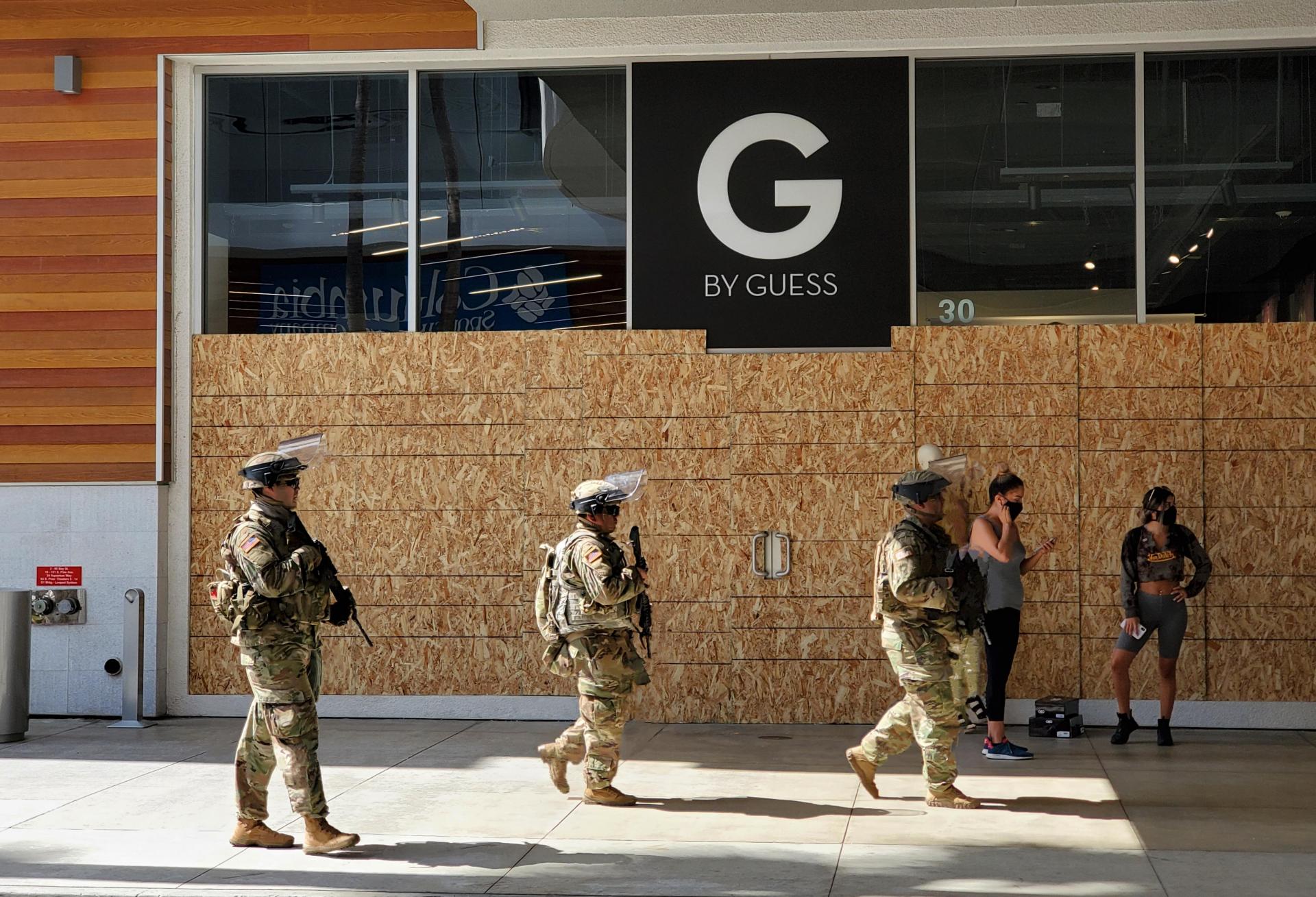 National Guardsmen patrol The Pike Outlets in Long Beach, California, Monday, June 1, 2020.