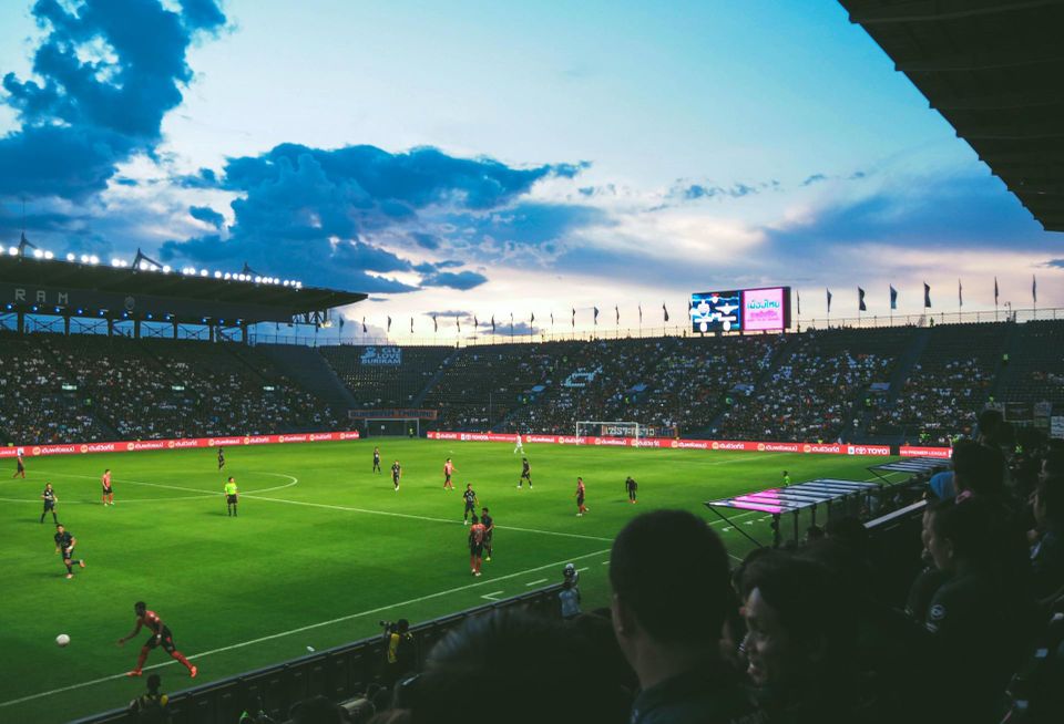 People watching a match in a soccer arena