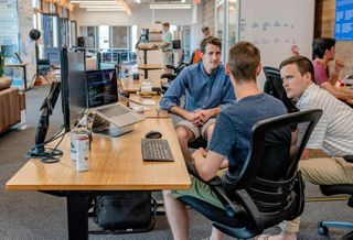 Men in shorts in office