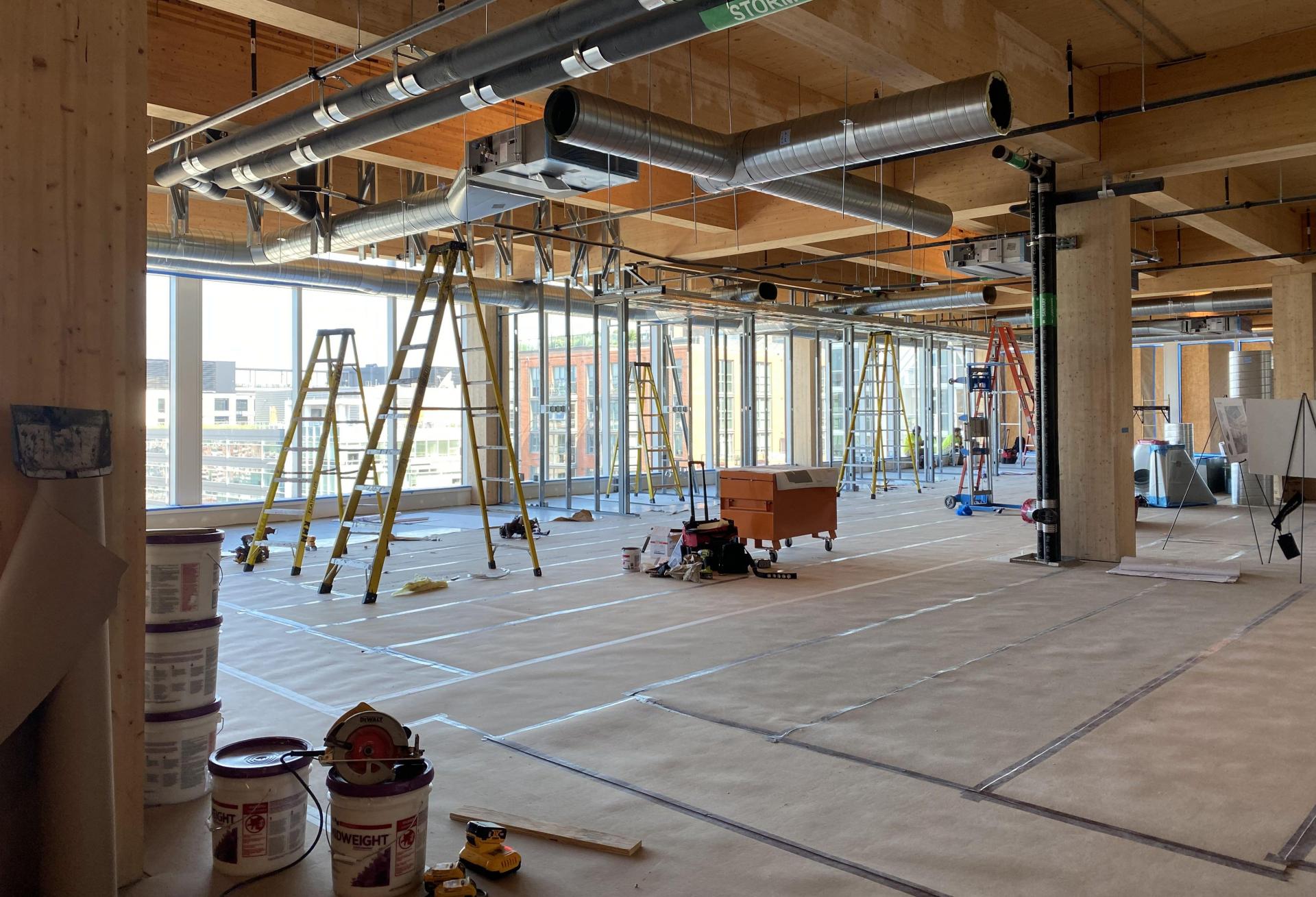 Contractors are completing tenant space in the addition to 80 M St. SE, one of D.C.'s first mass timber buildings.